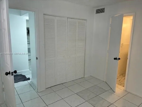 a bathroom with a sink toilet and a mirror