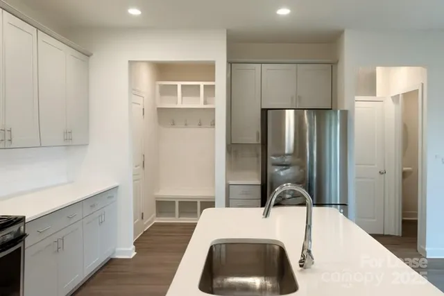 a bathroom with a toilet a sink and a mirror