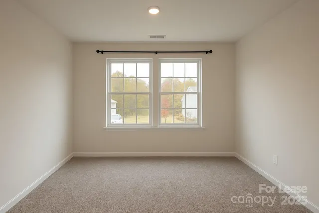 a bedroom with a bed and a refrigerator