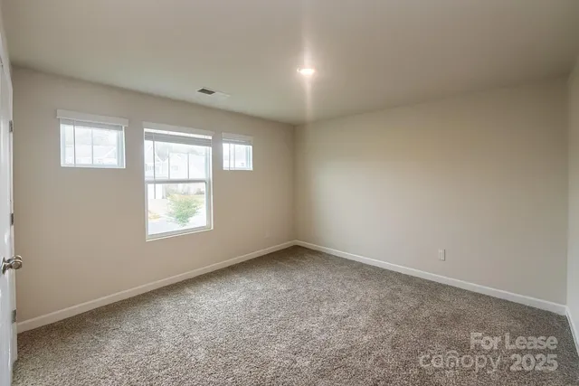 a kitchen with stainless steel appliances a refrigerator and a stove top oven