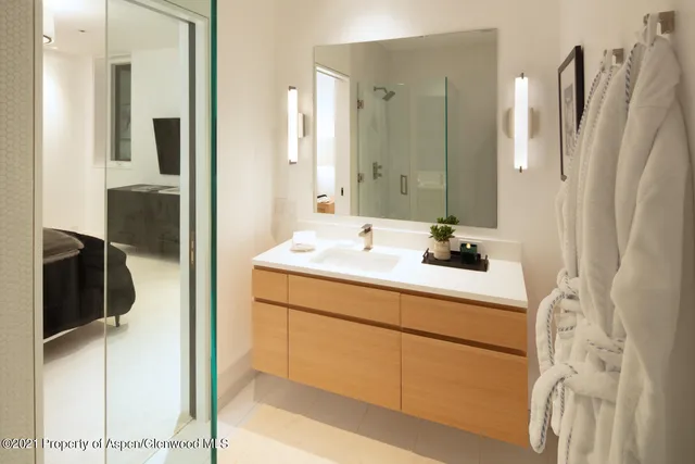 a bathroom with a sink and mirror