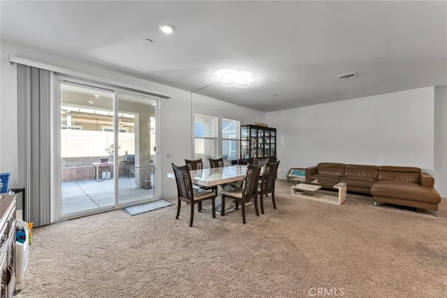 a bathroom with a shower sink vanity mirror and toilet