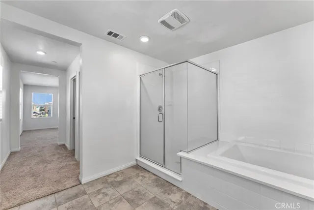 a bedroom with a bed and a television in it