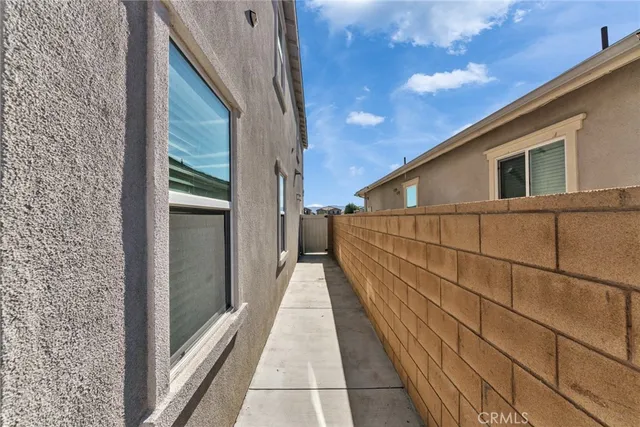 a view of living room kitchen and patio