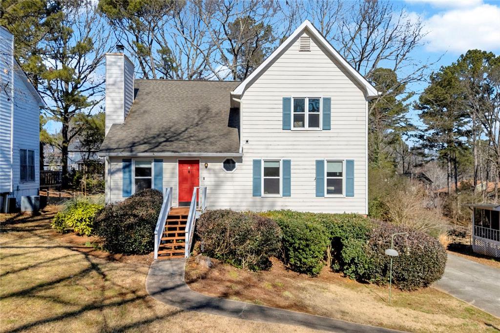 a view of a house with a yard