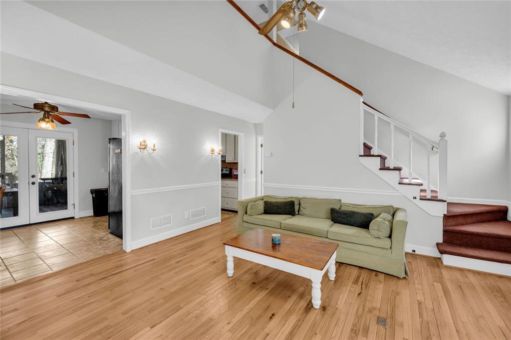 3765 Linwood Way Snellville, GA 30039 - Photo 11 of 53 a living room with furniture and a wooden floor