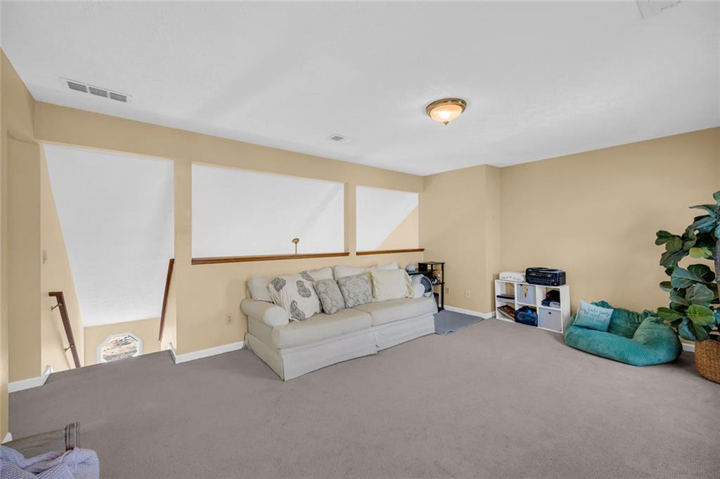 3765 Linwood Way Snellville, GA 30039 - Photo 14 of 53 a living room with furniture and a potted plant