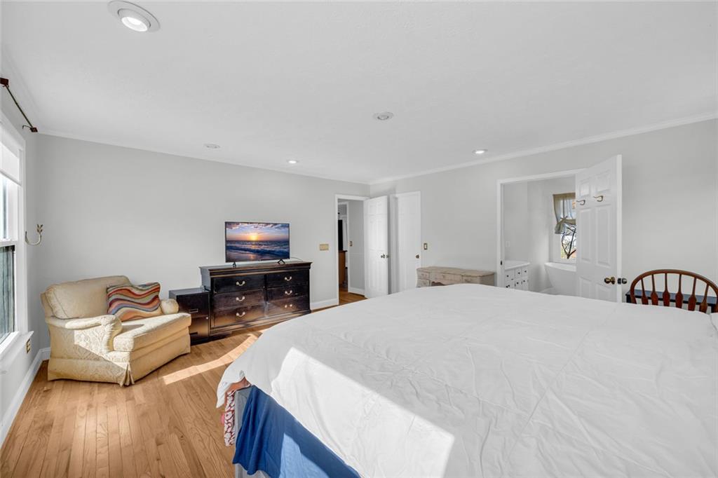 3765 Linwood Way Snellville, GA 30039 - Photo 26 of 53 a bedroom with furniture and a flat screen tv