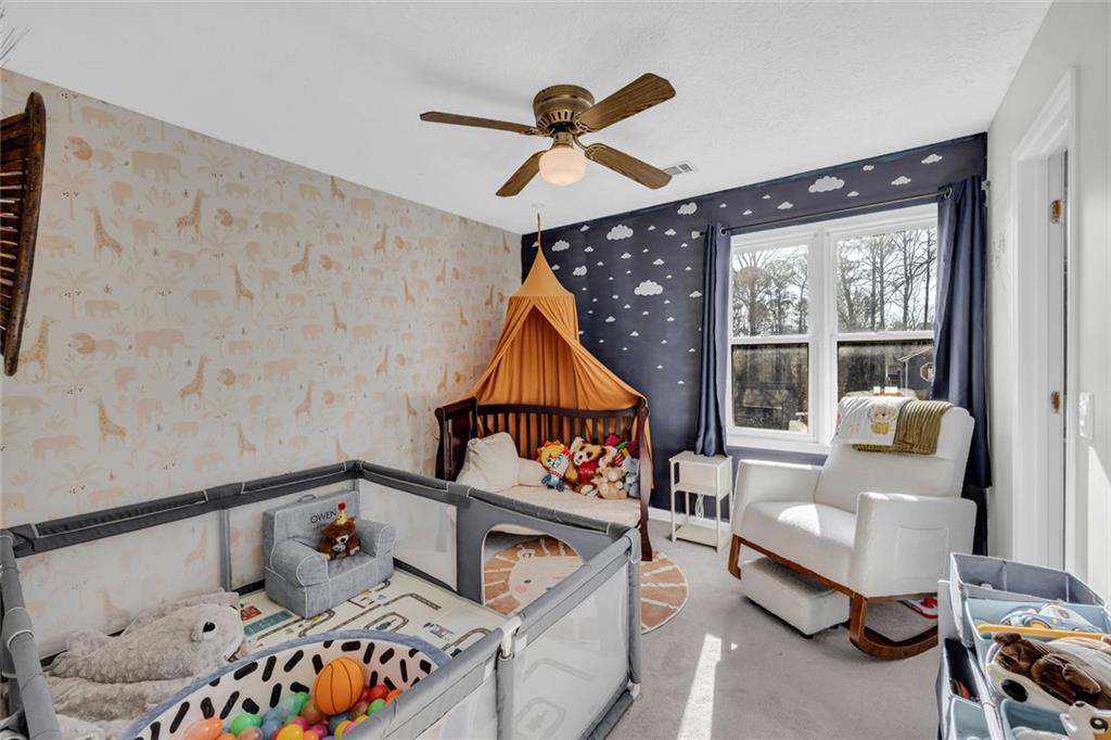 3765 Linwood Way Snellville, GA 30039 - Photo 33 of 53 a bedroom with furniture and a window