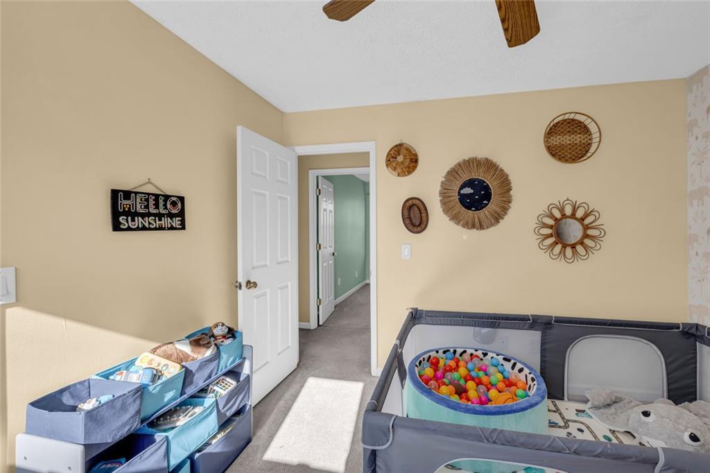 3765 Linwood Way Snellville, GA 30039 - Photo 34 of 53 a living room with furniture and a couch