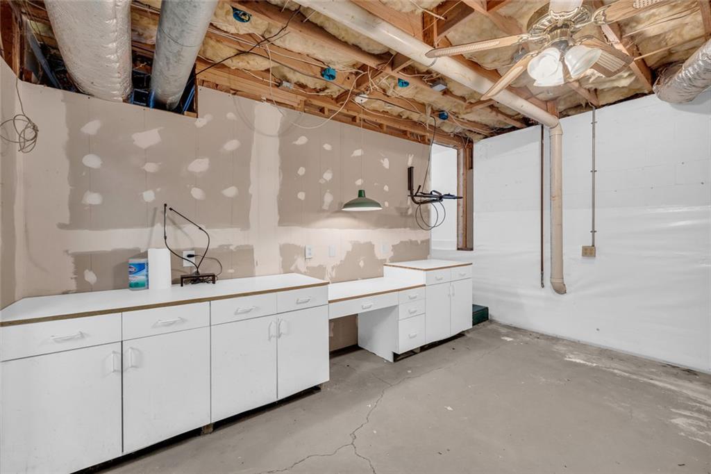 3765 Linwood Way Snellville, GA 30039 - Photo 42 of 53 a large room with lot of counter and windows