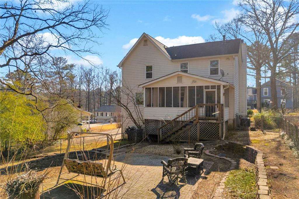 3765 Linwood Way Snellville, GA 30039 - Photo 43 of 53 a view of a chairs and table in backyard
