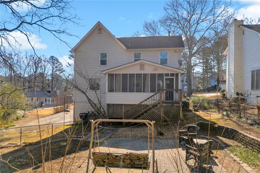 3765 Linwood Way Snellville, GA 30039 - Photo 44 of 53 a view of a house with backyard and sitting area