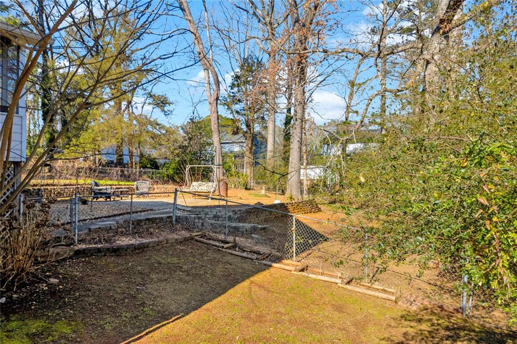 3765 Linwood Way Snellville, GA 30039 - Photo 47 of 53 a view of a yard with trees