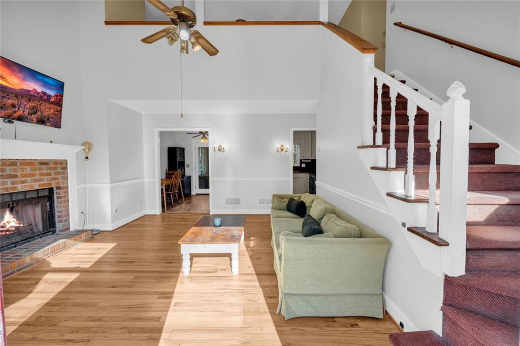 3765 Linwood Way Snellville, GA 30039 - Photo 8 of 53 a living room with furniture and a fireplace