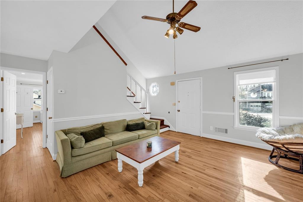 3765 Linwood Way Snellville, GA 30039 - Photo 10 of 53 a living room with furniture and a wooden floor