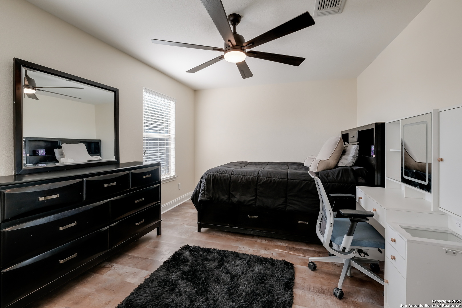 7207 Kitty Court Converse, TX 78109 - Photo 15 of 19 a bedroom with a bed and a mirror