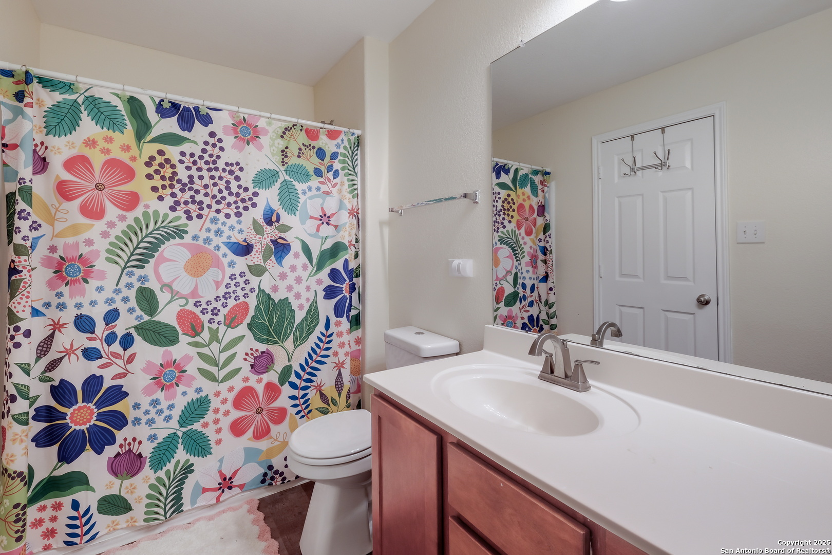 7207 Kitty Court Converse, TX 78109 - Photo 17 of 19 a bathroom with a sink and a toilet