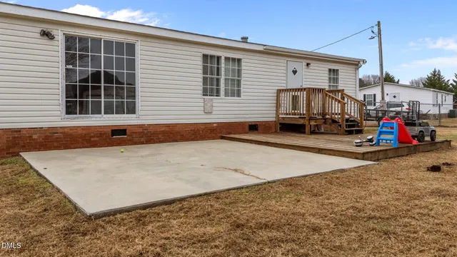 a view of a house with roof and furniture