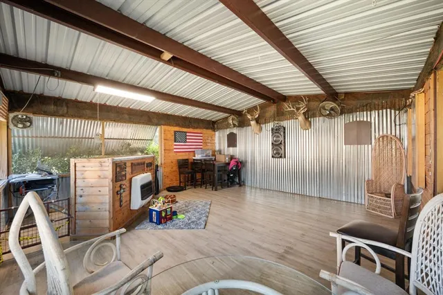 a view of a house with backyard porch and sitting area