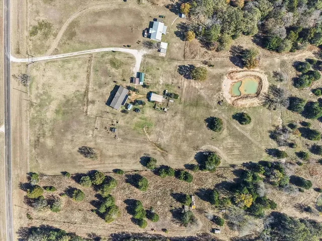 an aerial view of residential houses with outdoor space