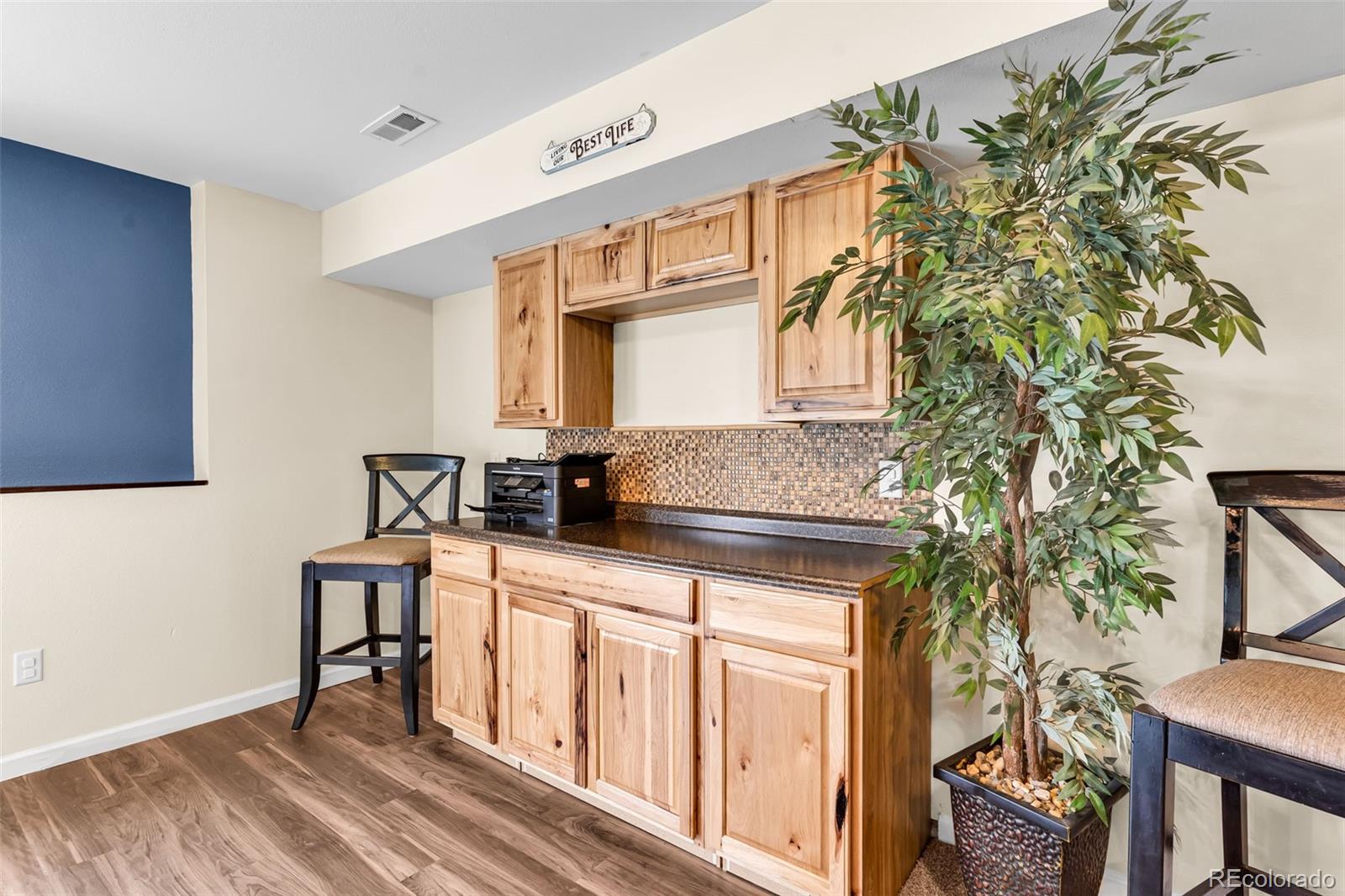 10380 Coyote Lane Rye, CO 81069 - Photo 25 of 50 a kitchen with granite countertop a stove a sink and a microwave