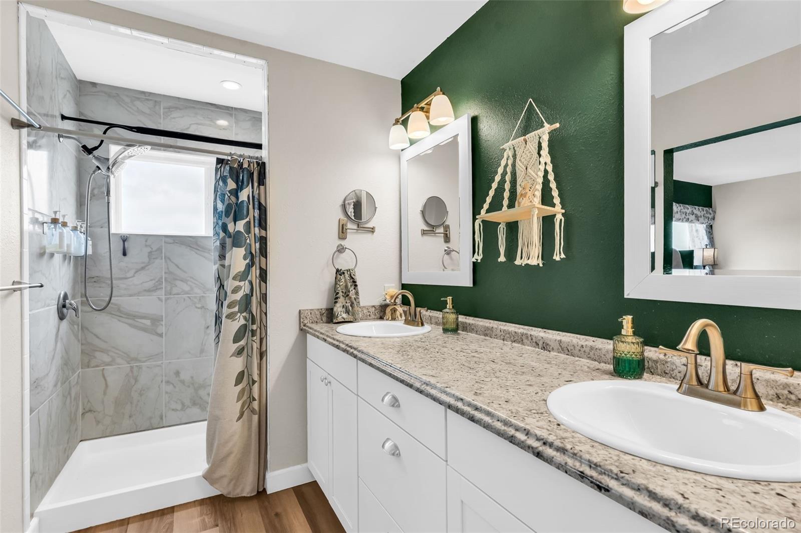 10380 Coyote Lane Rye, CO 81069 - Photo 42 of 50 a bathroom with a granite countertop sink vanity mirror and shower