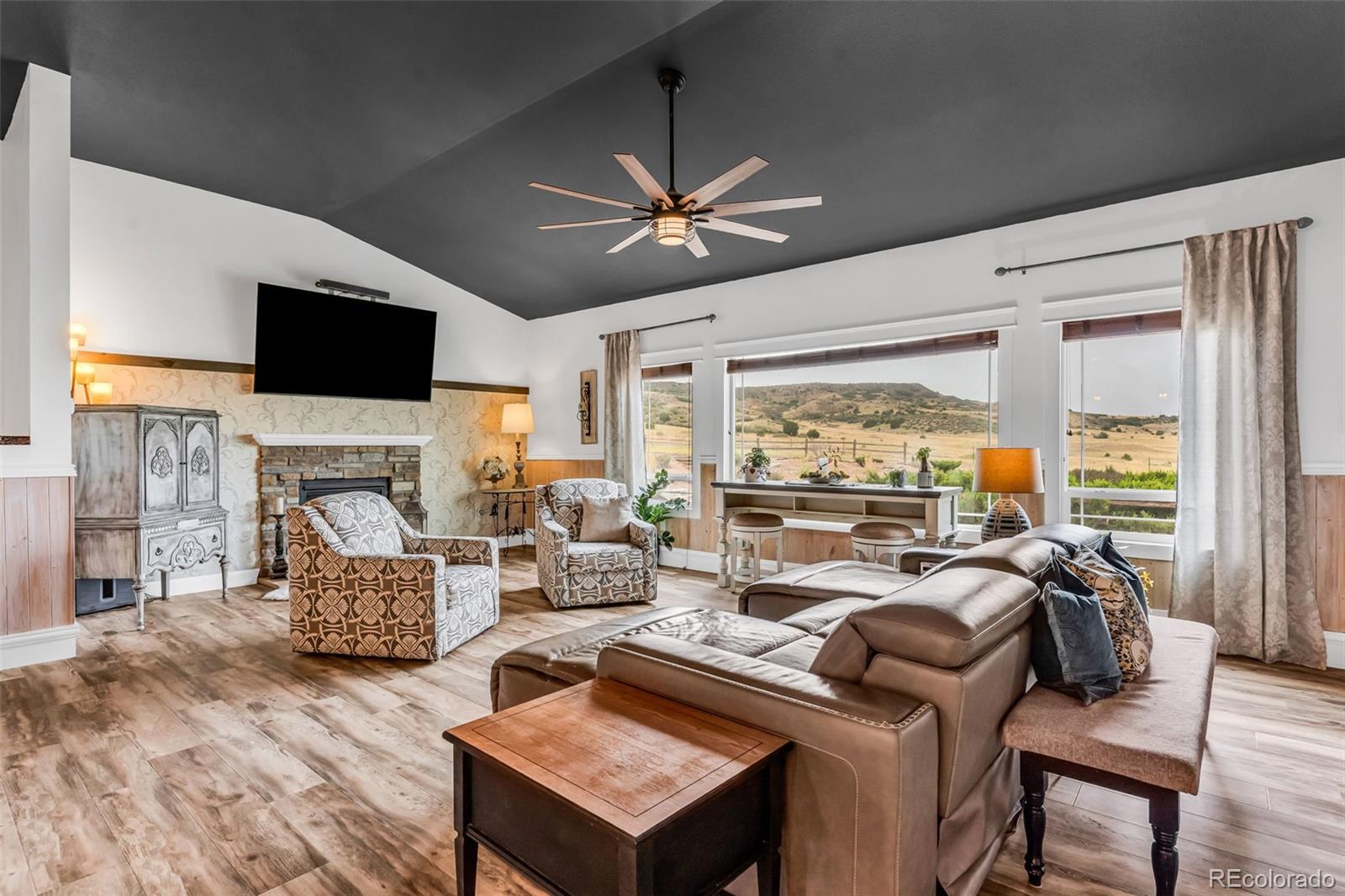 10380 Coyote Lane Rye, CO 81069 - Photo 6 of 50 a living room with furniture fireplace and a flat screen tv