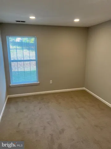 an empty room with a empty space and window