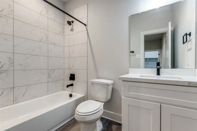 a bathroom with a sink a toilet and a bathtub