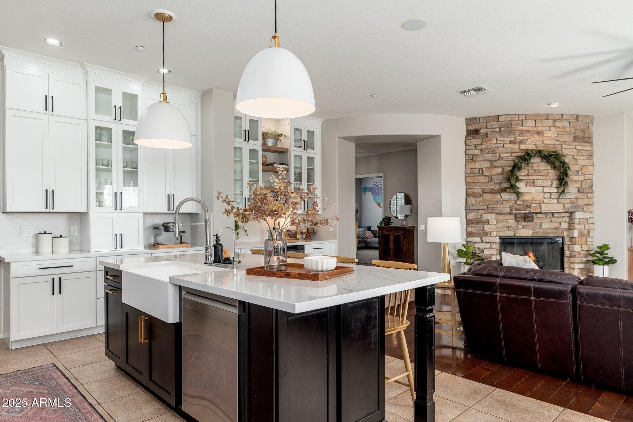 5712 East Blue Sky Drive Scottsdale, AZ 85266 - Photo 15 of 79 a kitchen with stainless steel appliances a sink stove and cabinets