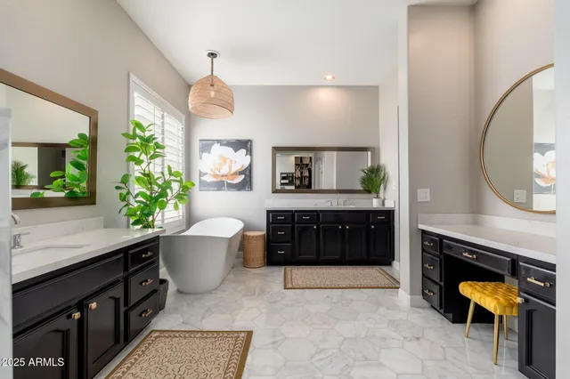 a bathroom with a granite countertop sink a toilet and a mirror