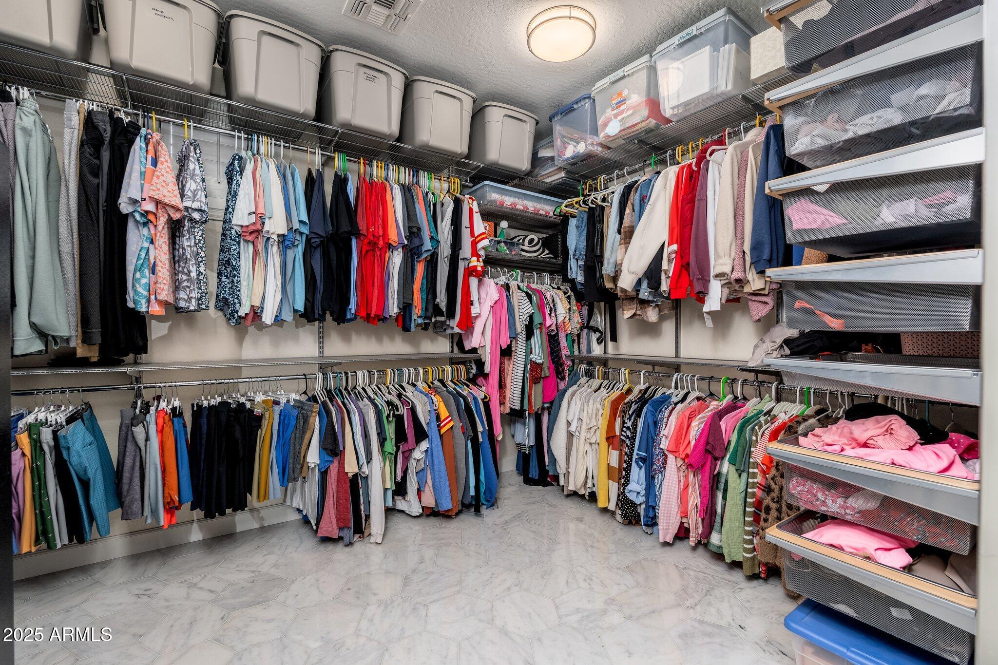 5712 East Blue Sky Drive Scottsdale, AZ 85266 - Photo 26 of 79 a view of walk in closet with clothes