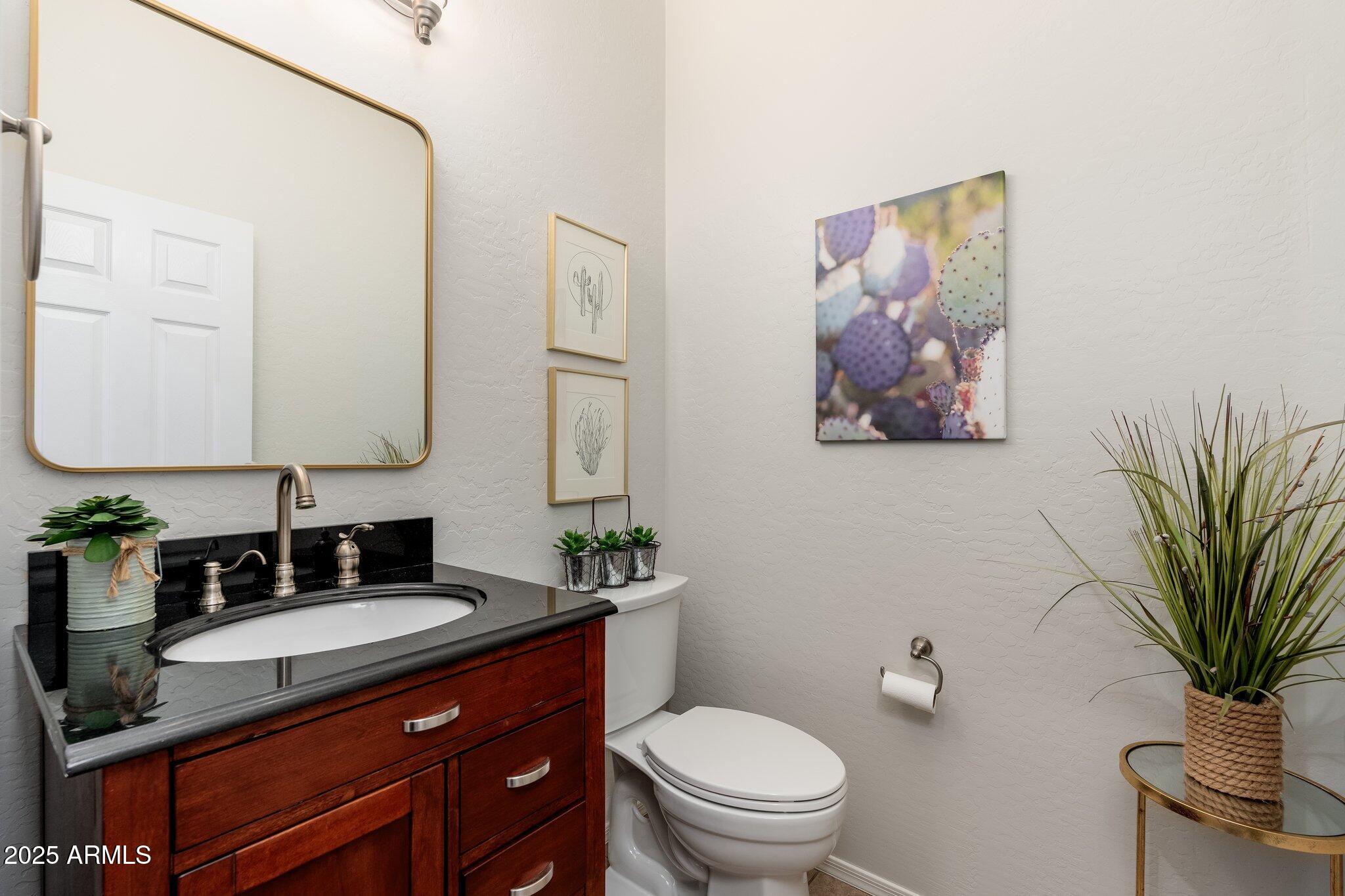 5712 East Blue Sky Drive Scottsdale, AZ 85266 - Photo 29 of 79 a bathroom with a granite countertop sink mirror and toilet