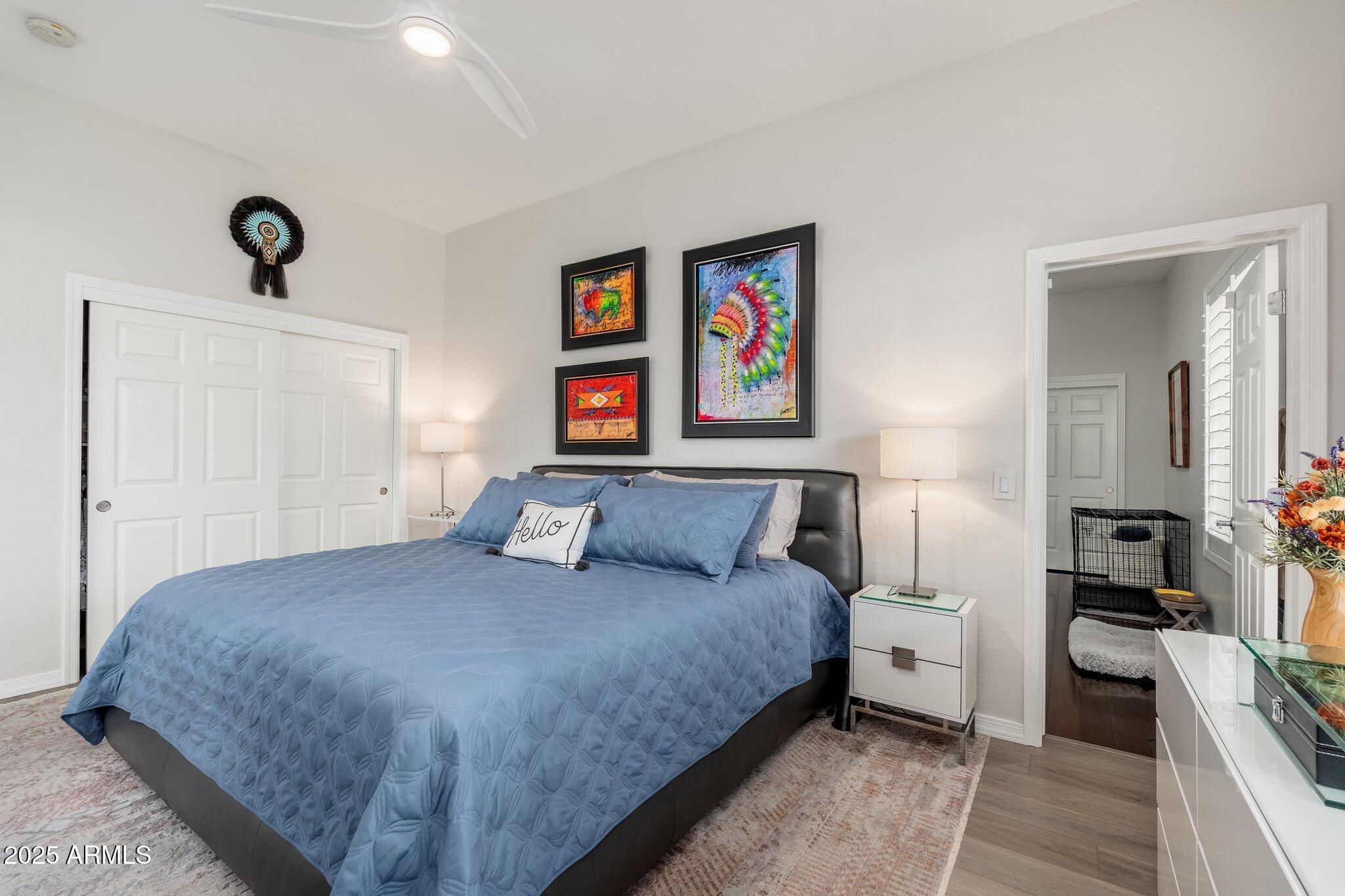 5712 East Blue Sky Drive Scottsdale, AZ 85266 - Photo 37 of 79 a bedroom with a bed and a painting on the wall