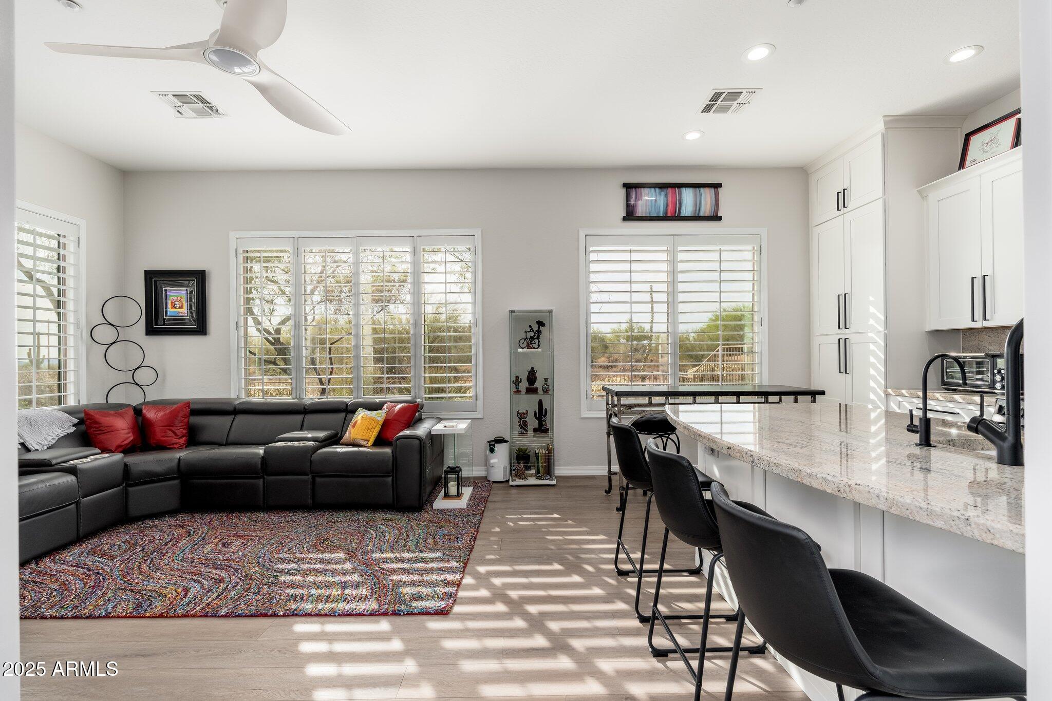 5712 East Blue Sky Drive Scottsdale, AZ 85266 - Photo 40 of 79 a living room with furniture window and wooden floor