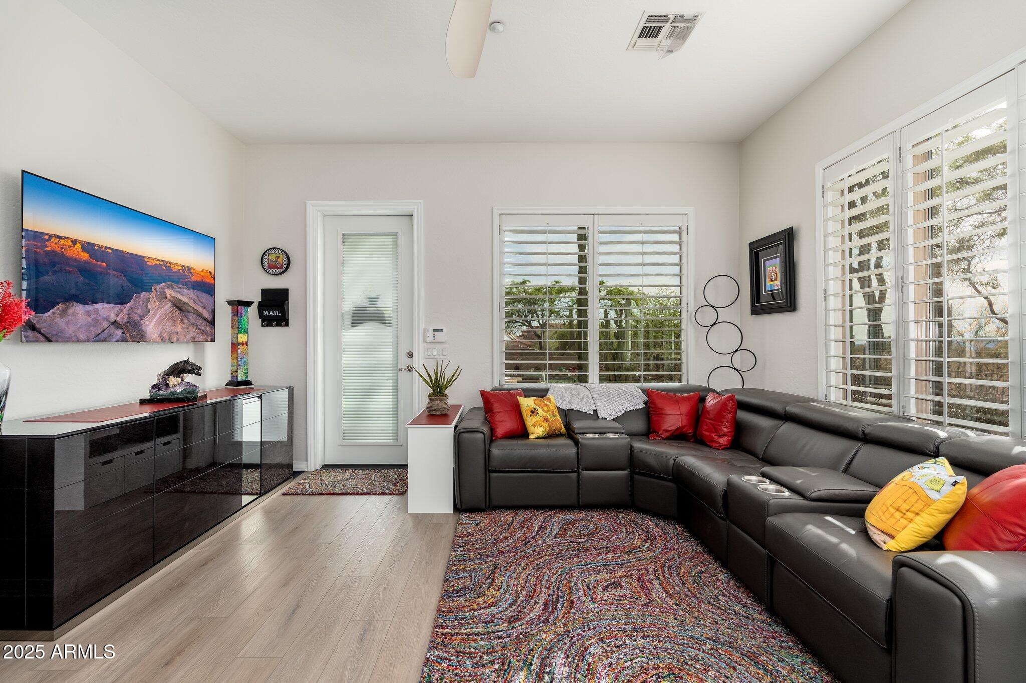 5712 East Blue Sky Drive Scottsdale, AZ 85266 - Photo 41 of 79 a living room with furniture and a flat screen tv