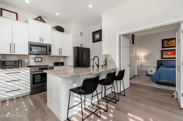 a view of a patio with table and chairs and potted plants