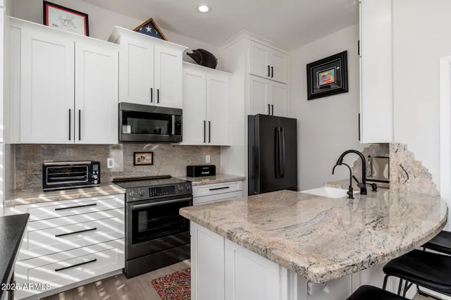 a view of a swimming pool with outdoor seating