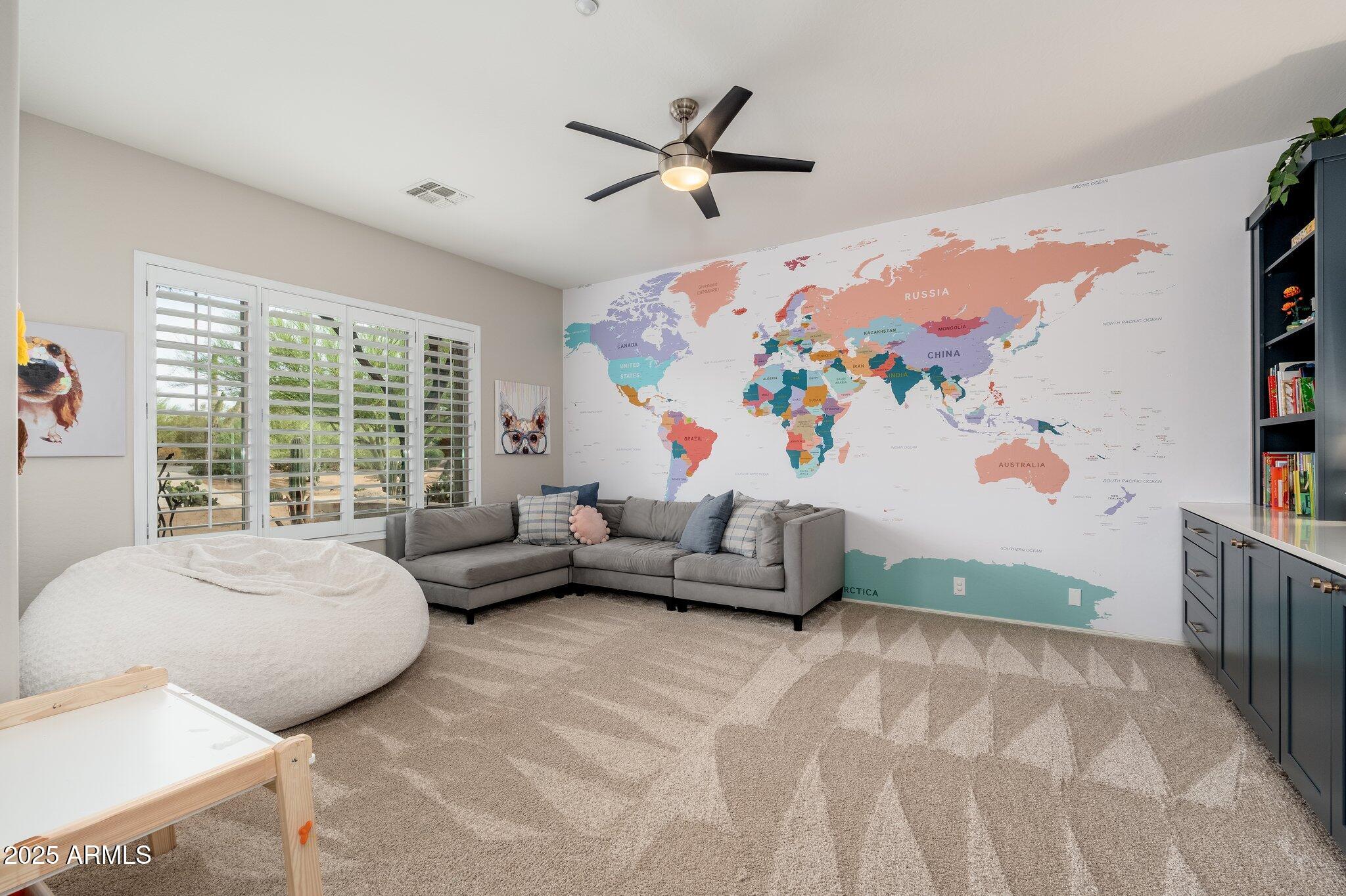 5712 East Blue Sky Drive Scottsdale, AZ 85266 - Photo 5 of 79 a bedroom with furniture and a large window