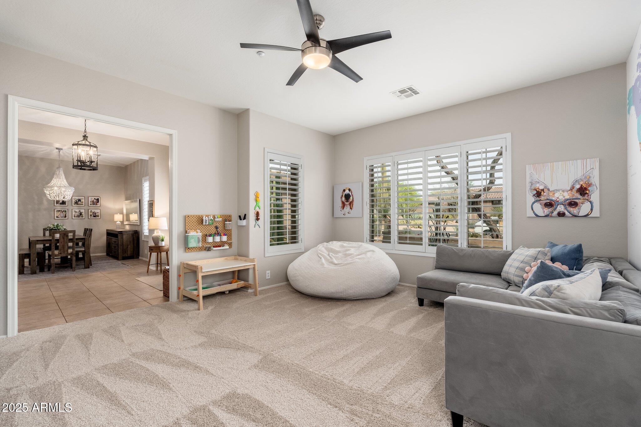 5712 East Blue Sky Drive Scottsdale, AZ 85266 - Photo 6 of 79 a living room with furniture and a large window