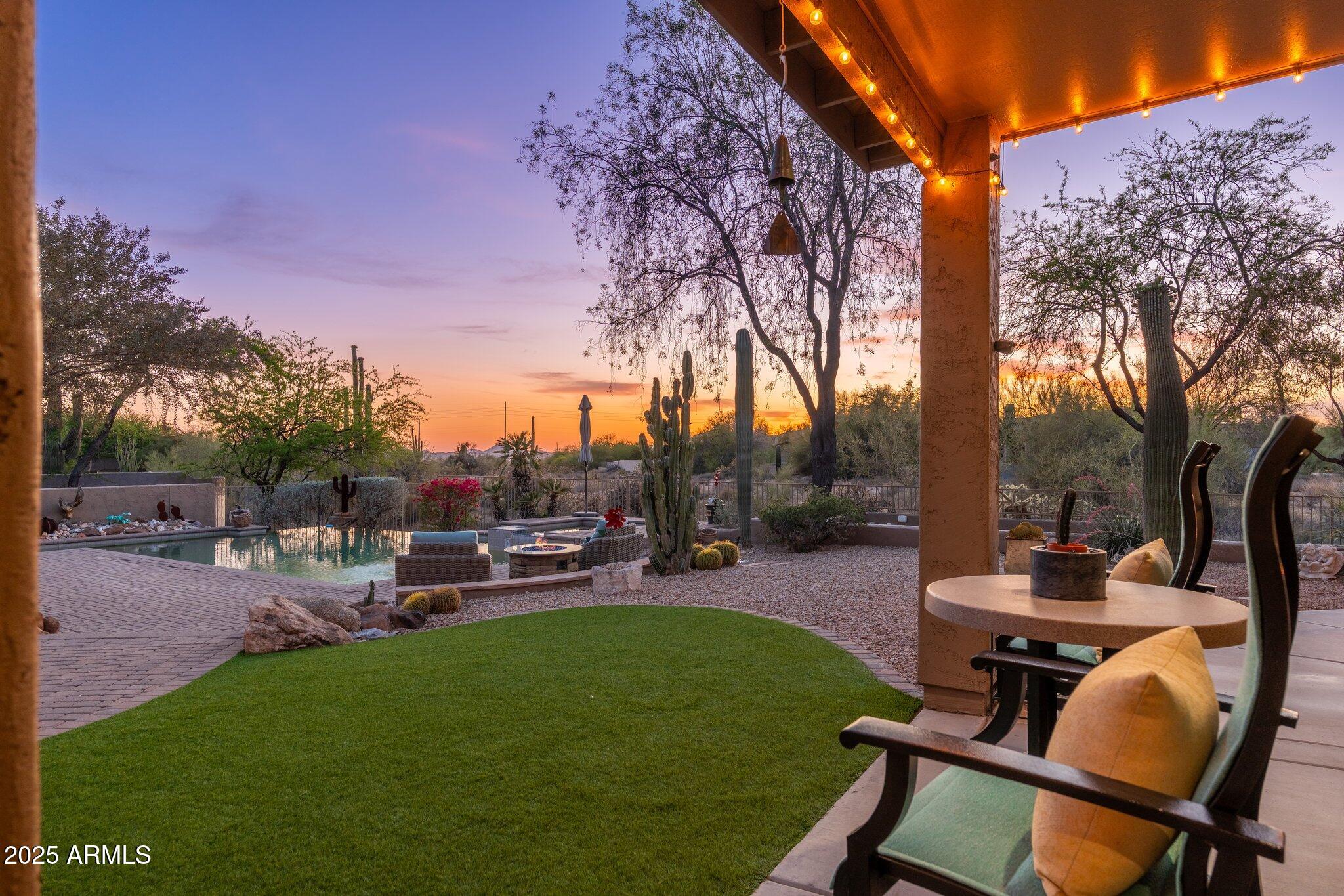 5712 East Blue Sky Drive Scottsdale, AZ 85266 - Photo 64 of 79 a view of a backyard with sitting area