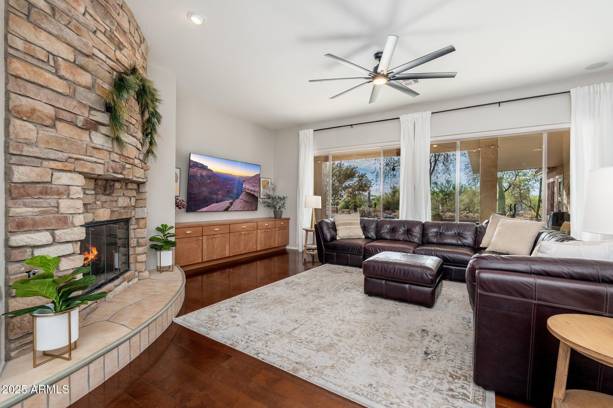 5712 East Blue Sky Drive Scottsdale, AZ 85266 - Photo 9 of 79 a living room with furniture and a flat screen tv
