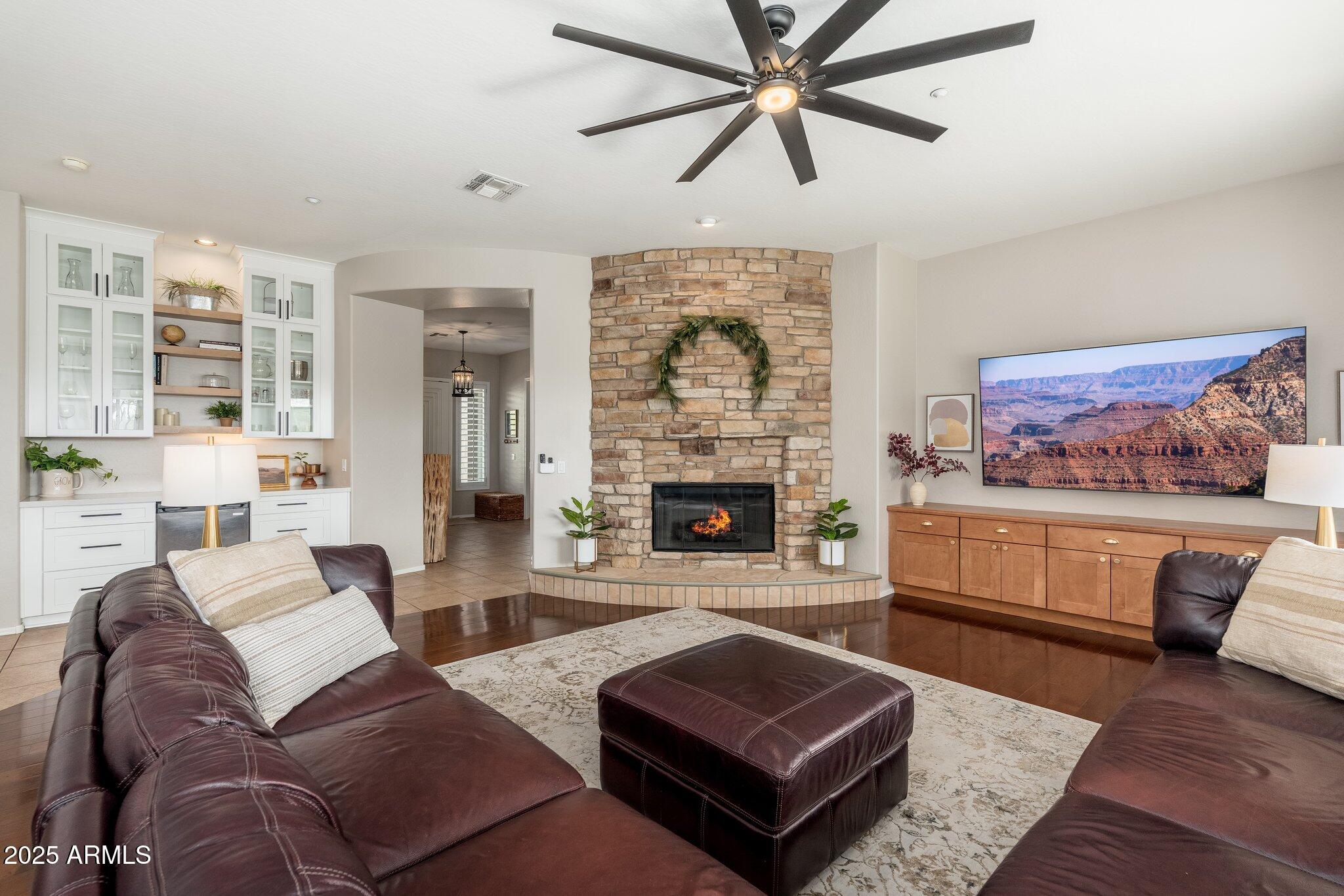 5712 East Blue Sky Drive Scottsdale, AZ 85266 - Photo 10 of 79 a living room with furniture a fireplace