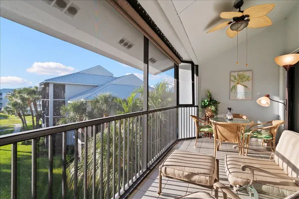 a view of a balcony with furniture