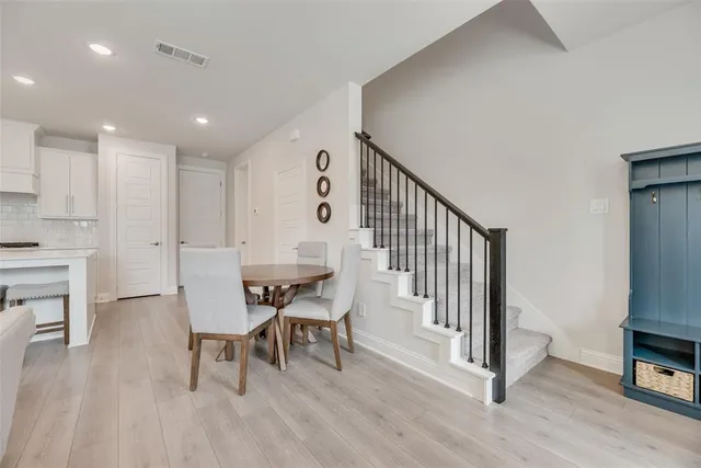 a view of dining room with furniture and wooden floor