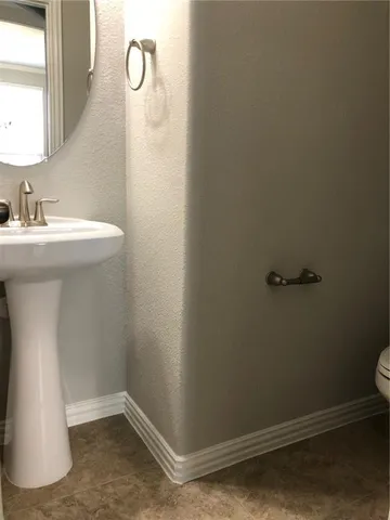 a bathroom with a sink and mirror