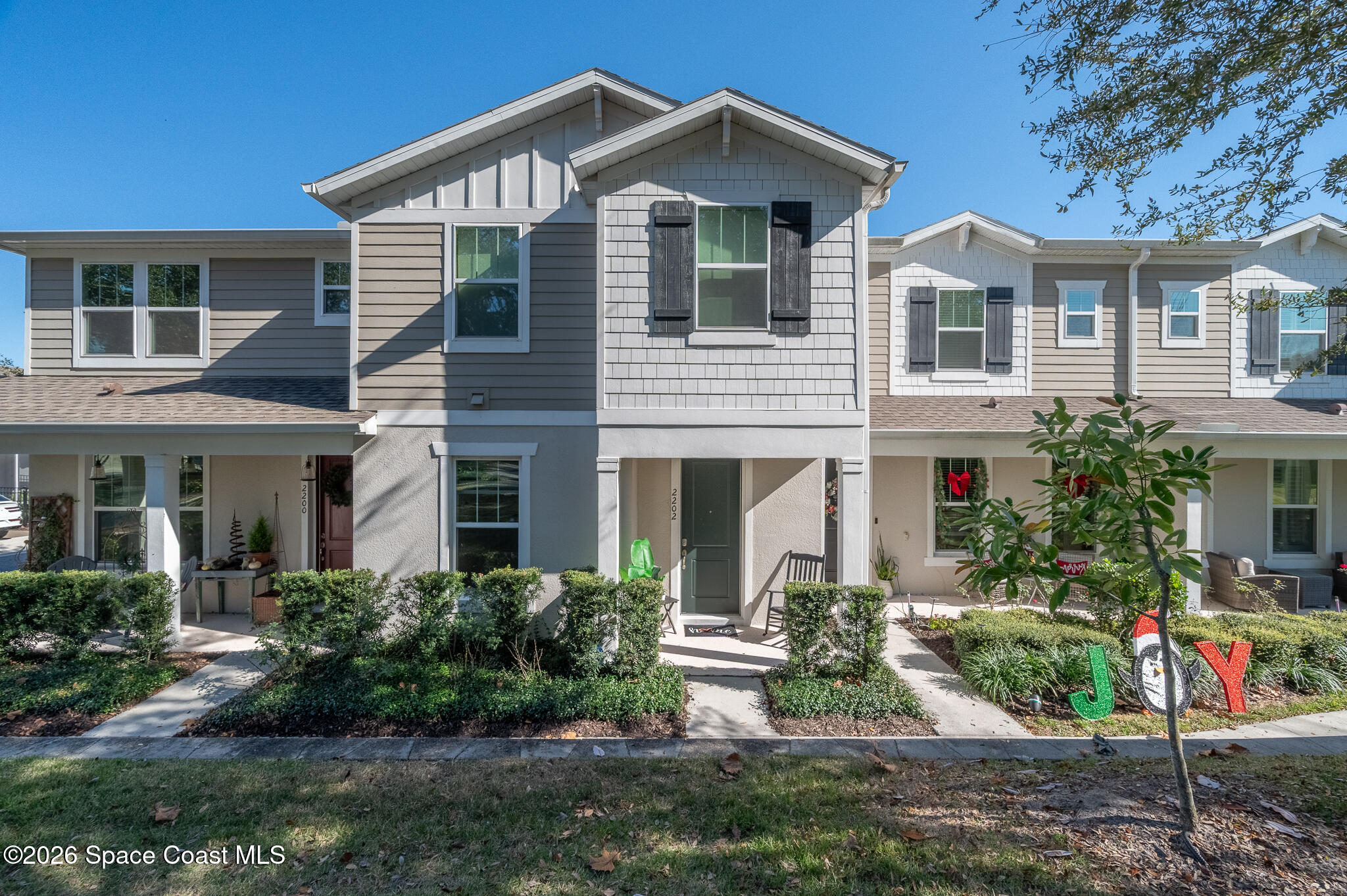 2202 Gopher Tortoise Terrace Oakland, FL 34787 - Photo 1 of 42 a front view of a house with a yard