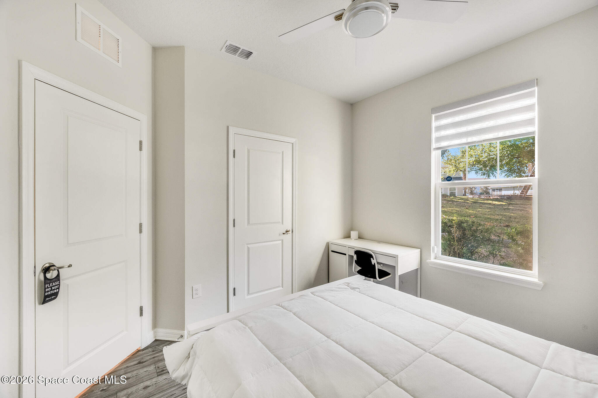 2202 Gopher Tortoise Terrace Oakland, FL 34787 - Photo 14 of 42 a bedroom with a bed and a window