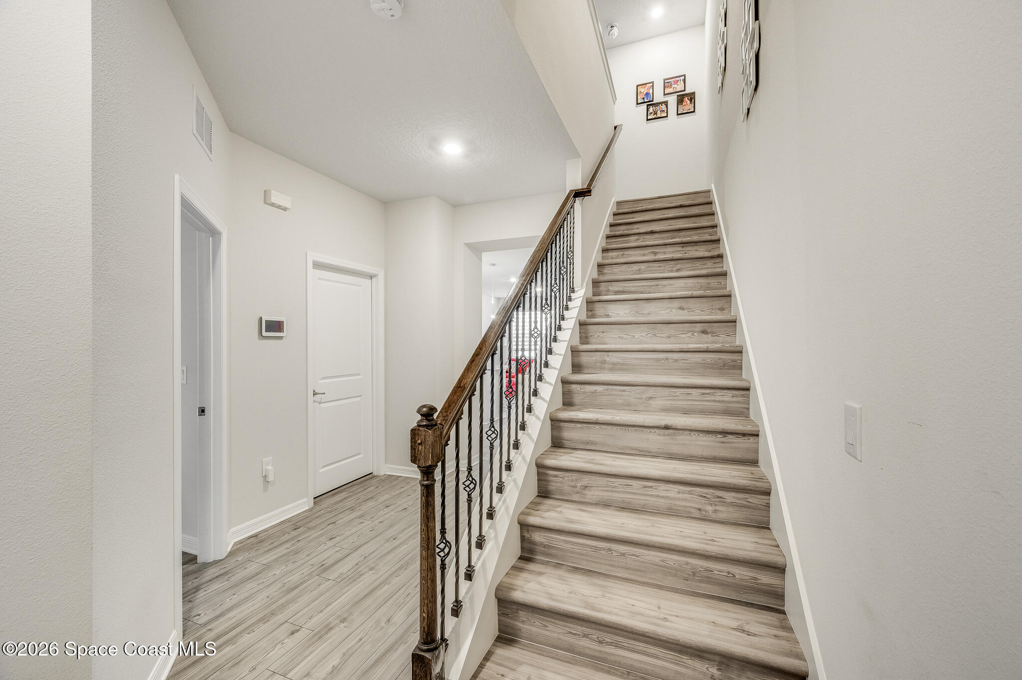 2202 Gopher Tortoise Terrace Oakland, FL 34787 - Photo 16 of 42 a view of entryway and hall with wooden floor